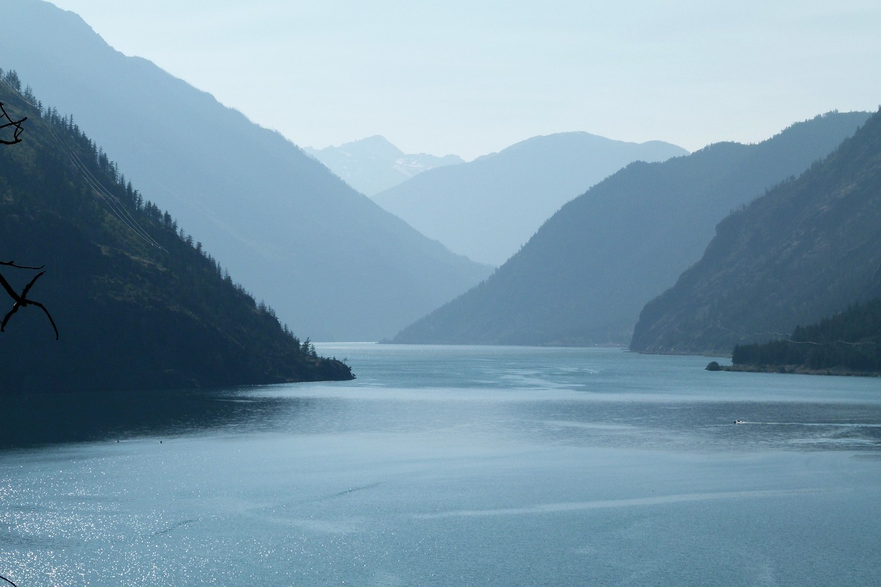 mountains and a lake in a haze of blue 