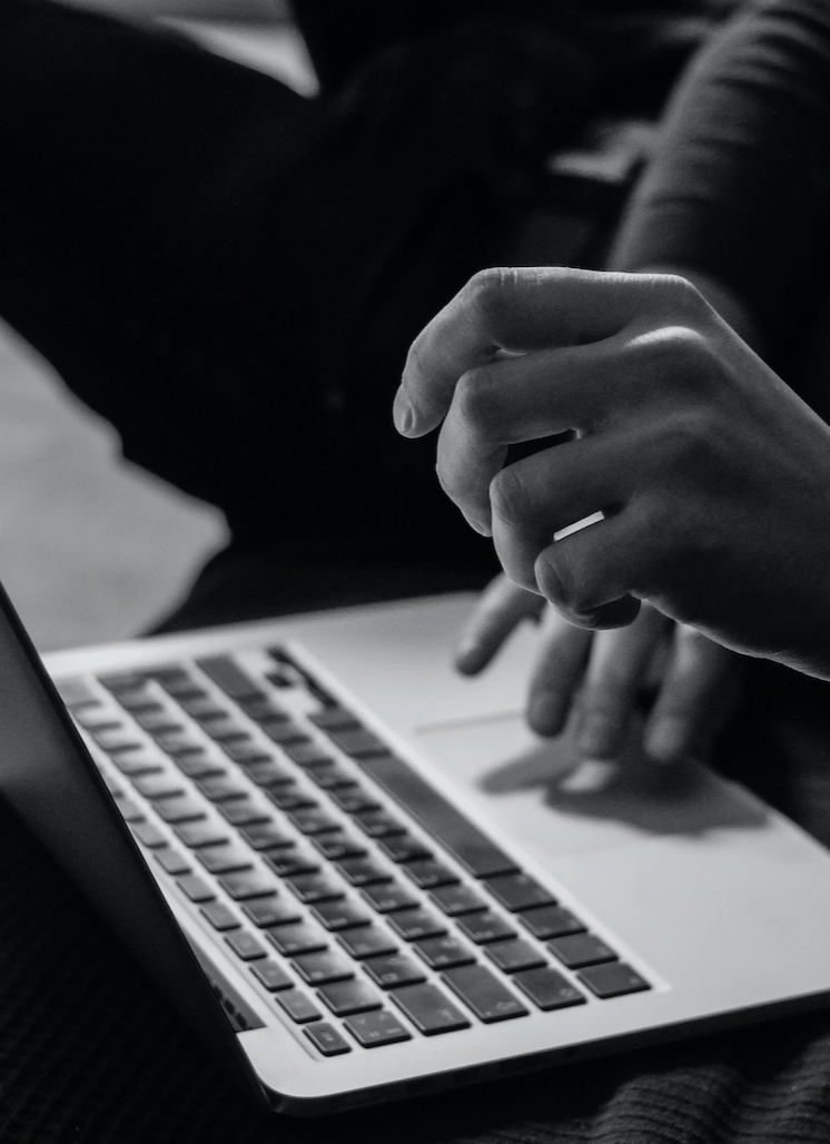 A man bangs the keys of a classic typewriter.