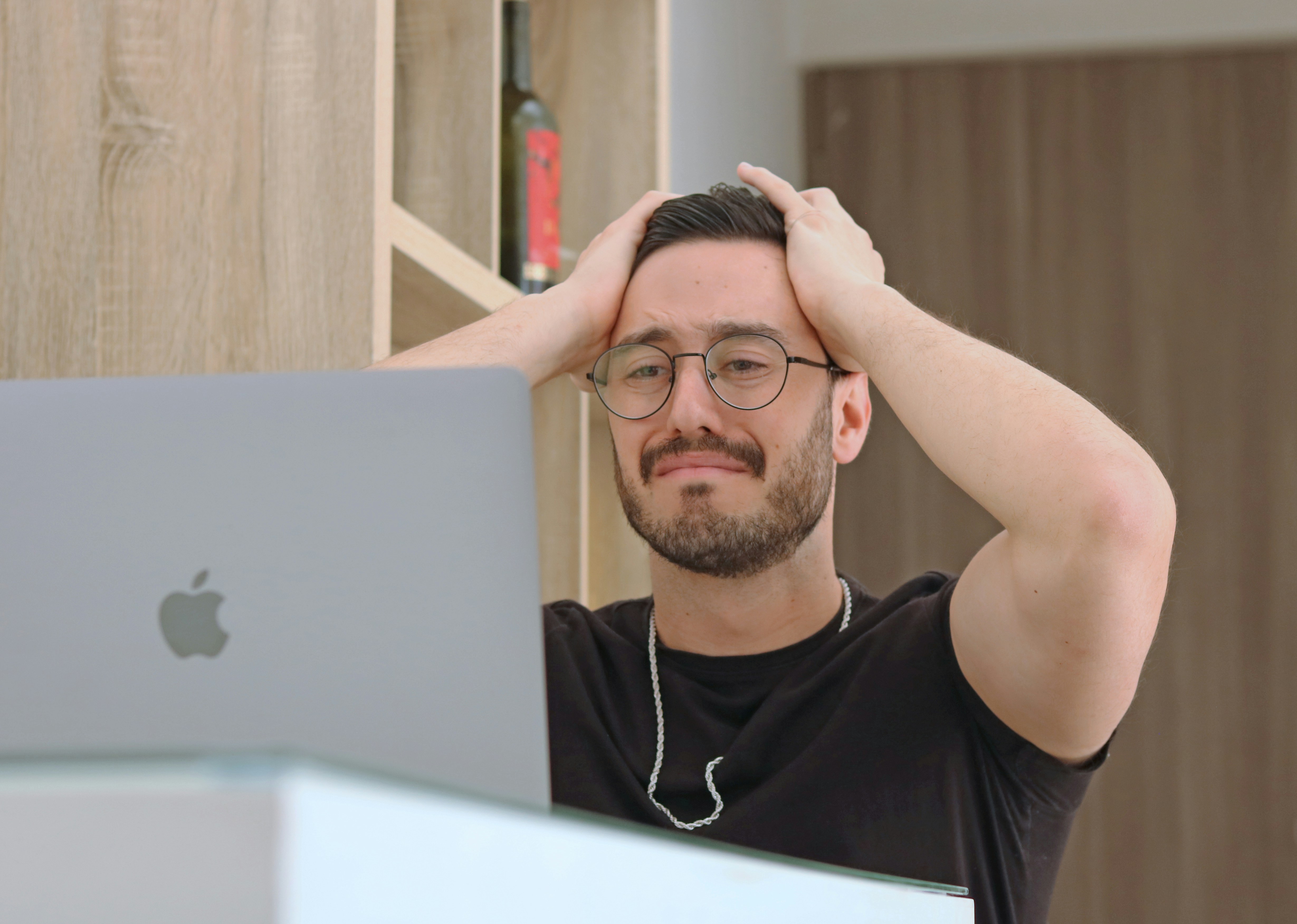 Man upset in front of computer