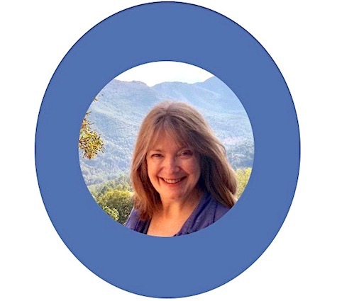 Annette Merrick looking at camera with countryside background