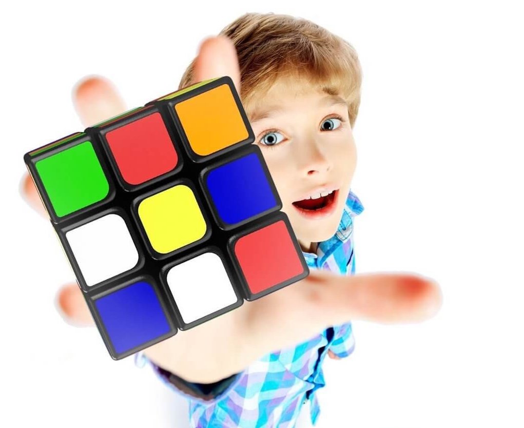 boy play rubik's cube