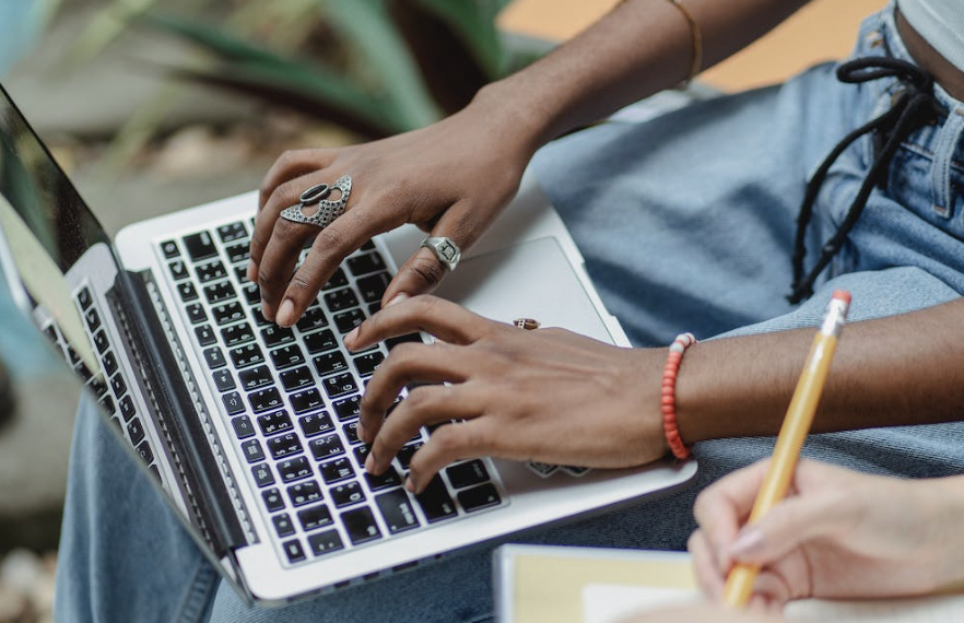 Woman typing on a laptop