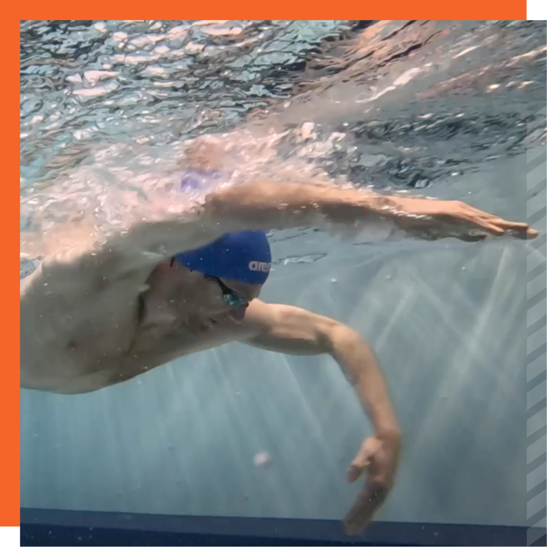 Image of a swimmer underwater who is practicing a specific body position.