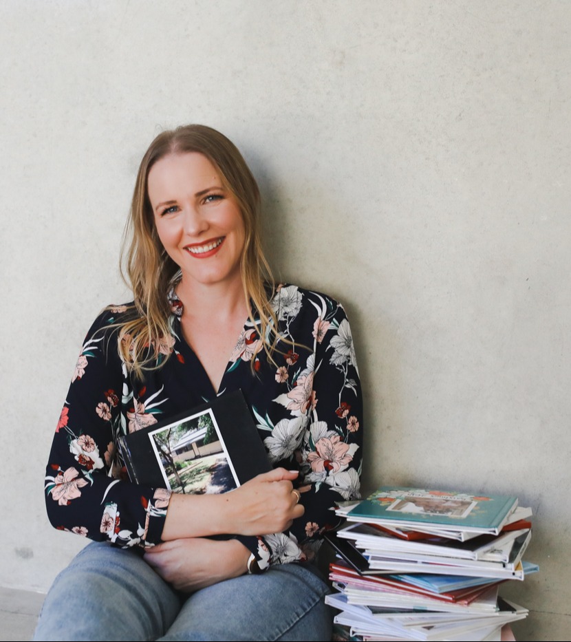  Melissa with a stack of photo books