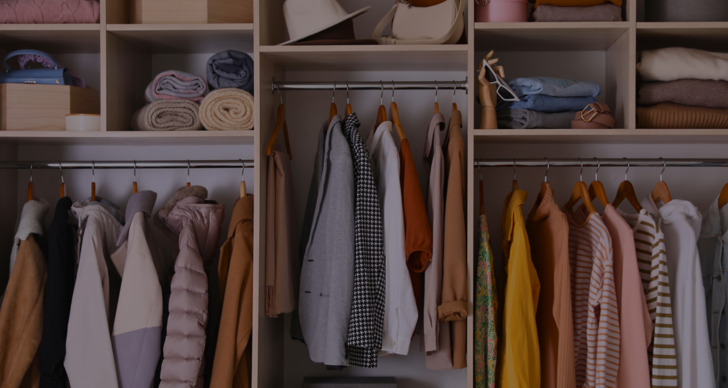 beautifully organized closet full of stylish coordinating clothes and accessories