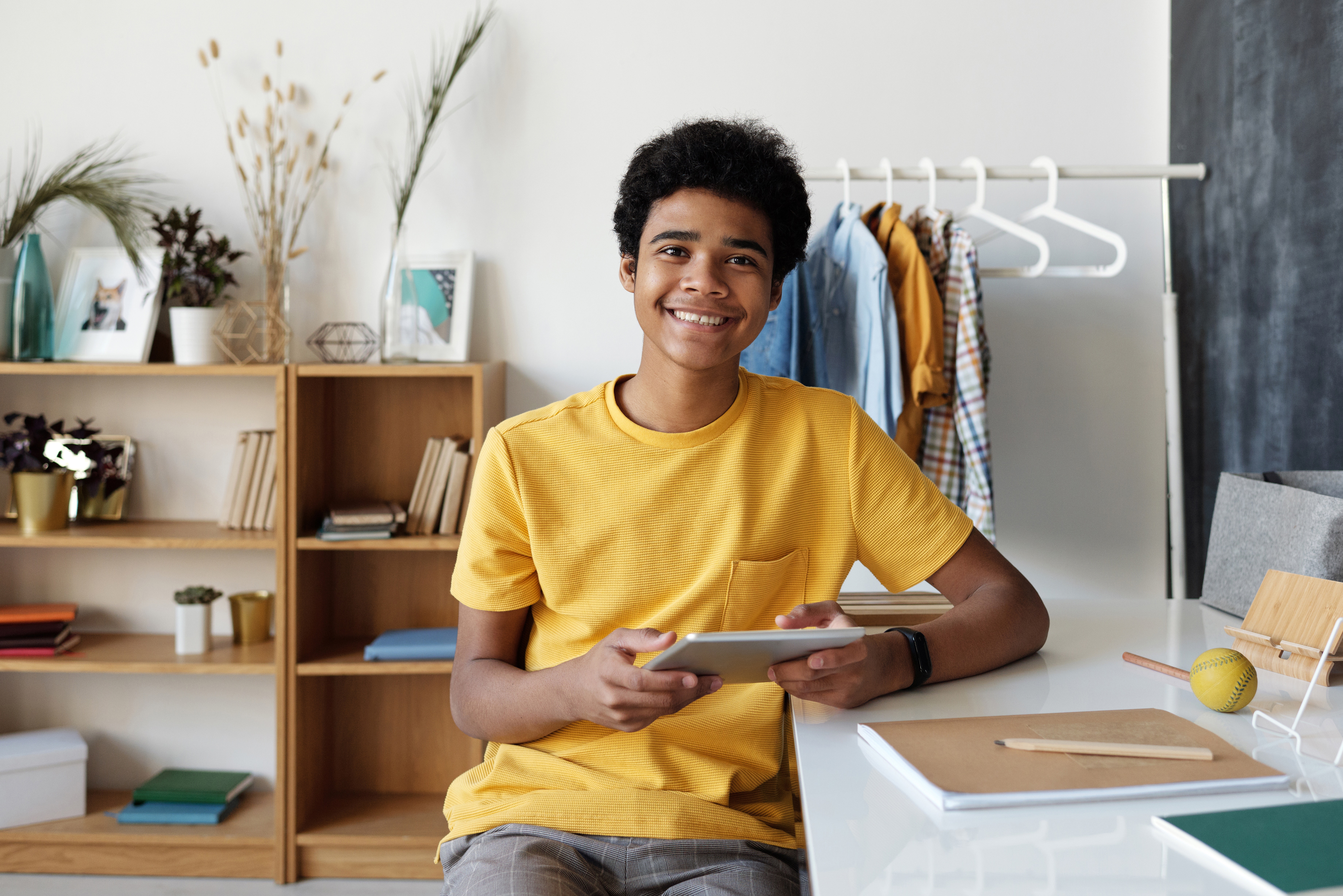 boy with iPad in home office