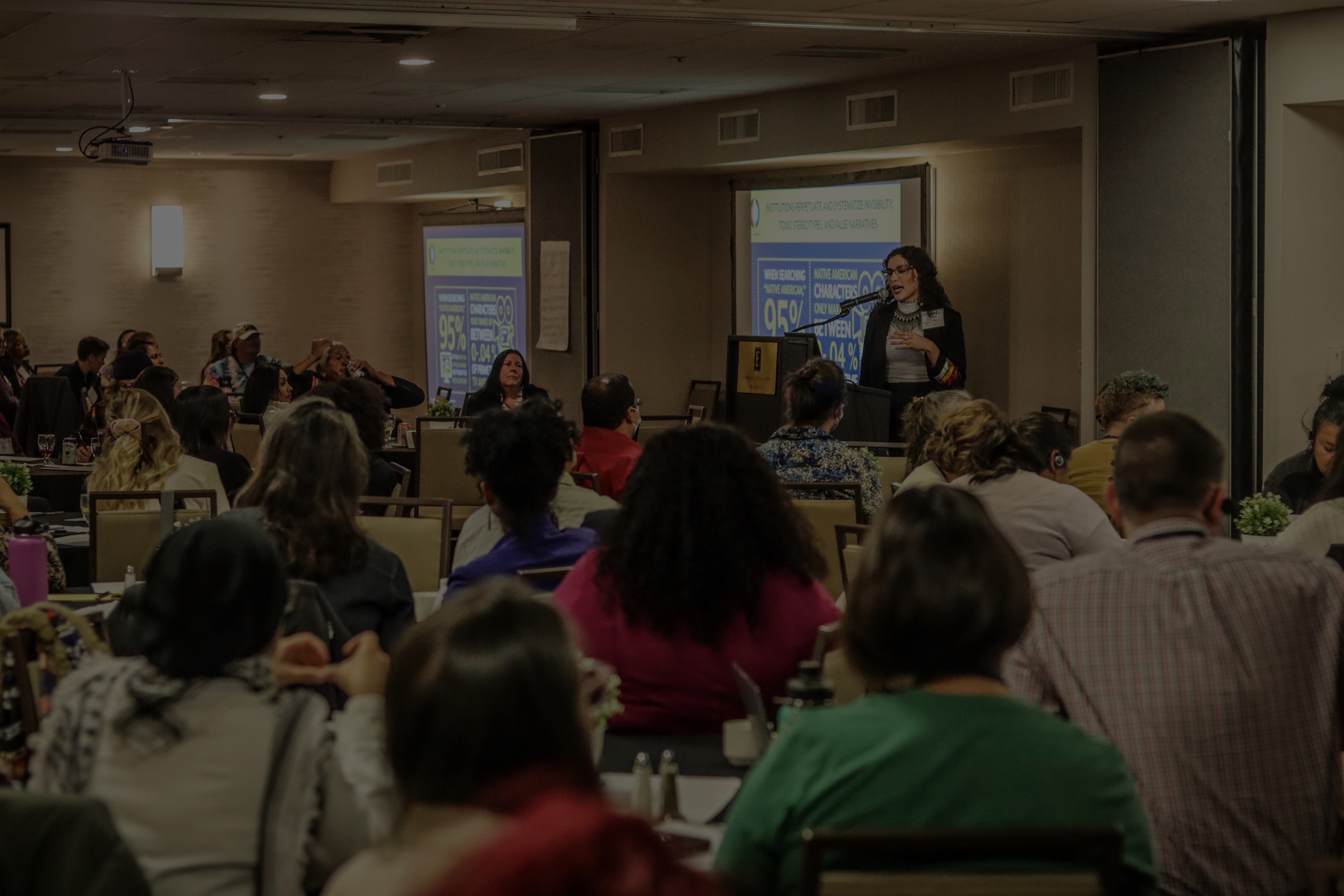 People at a conference presentation