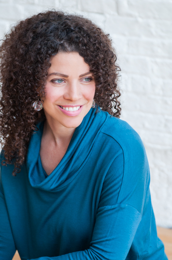 Heather Fraelick wearing teal sweater in profile headshot