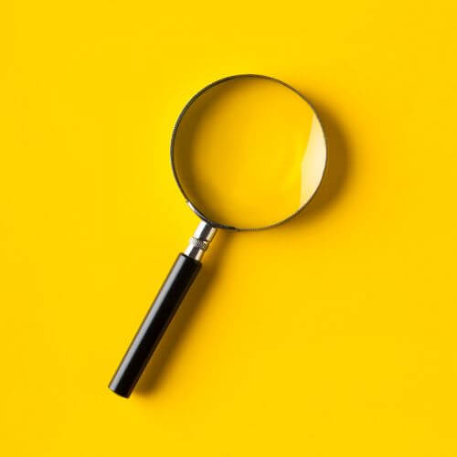 Magnifying glass on a yellow background