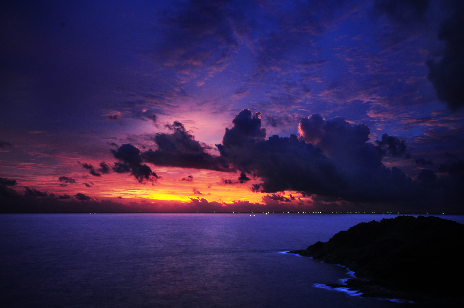 A dark blue sunset over the sea in Phuket, Thailand