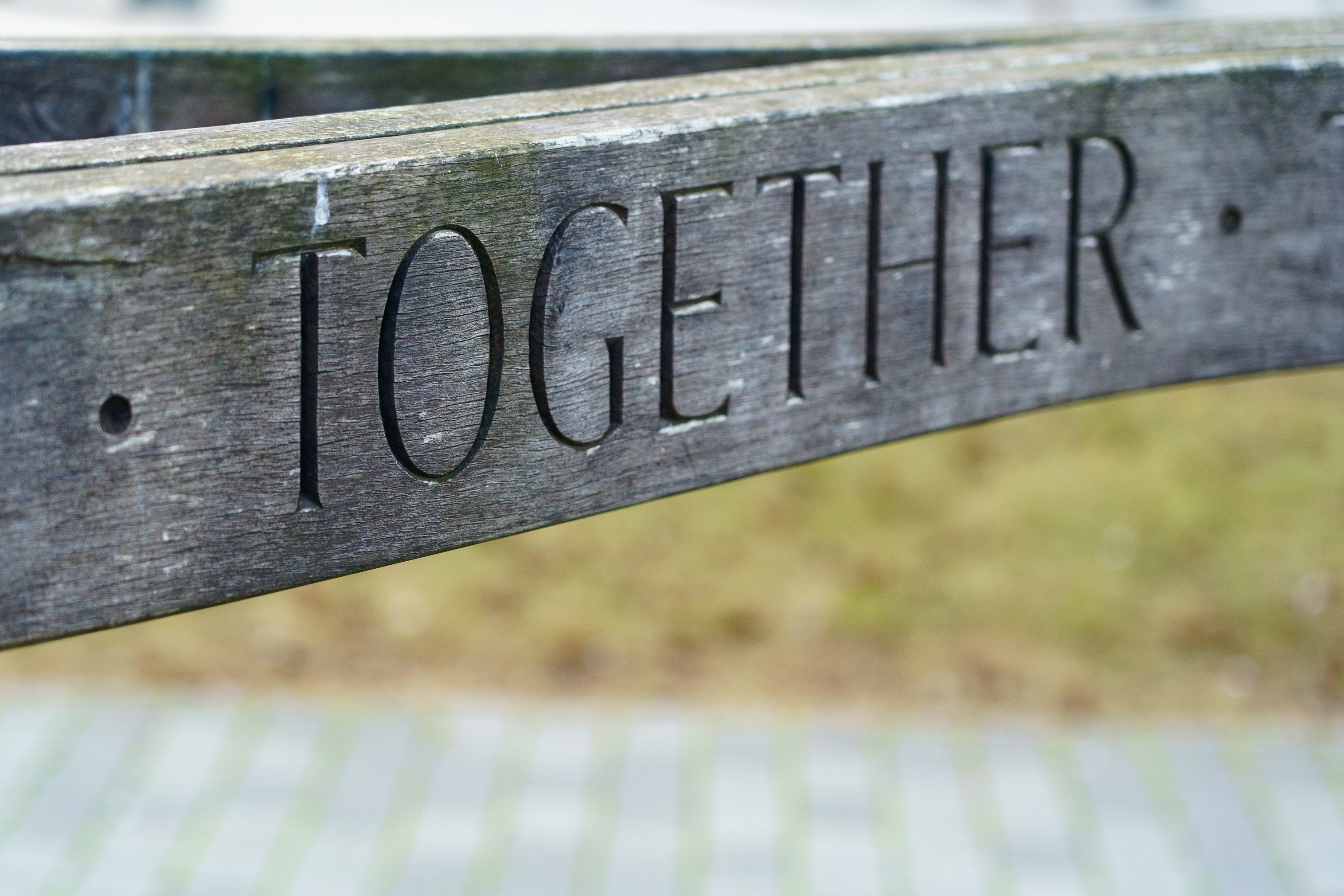 Together engraved on piece of wood