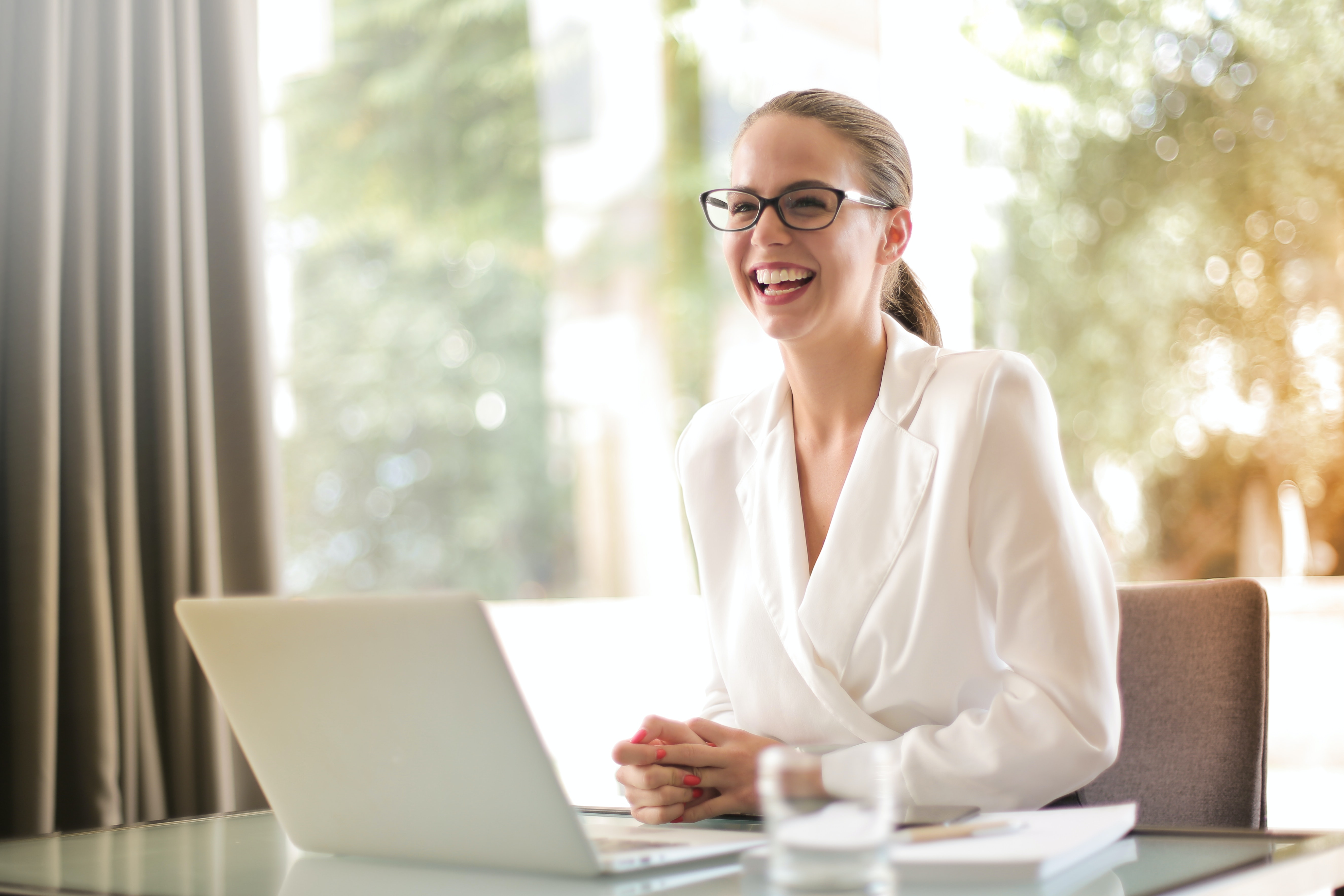 Photo by Andrea Piacquadio: https://www.pexels.com/photo/laughing-businesswoman-working-in-office-with-laptop-3756679/