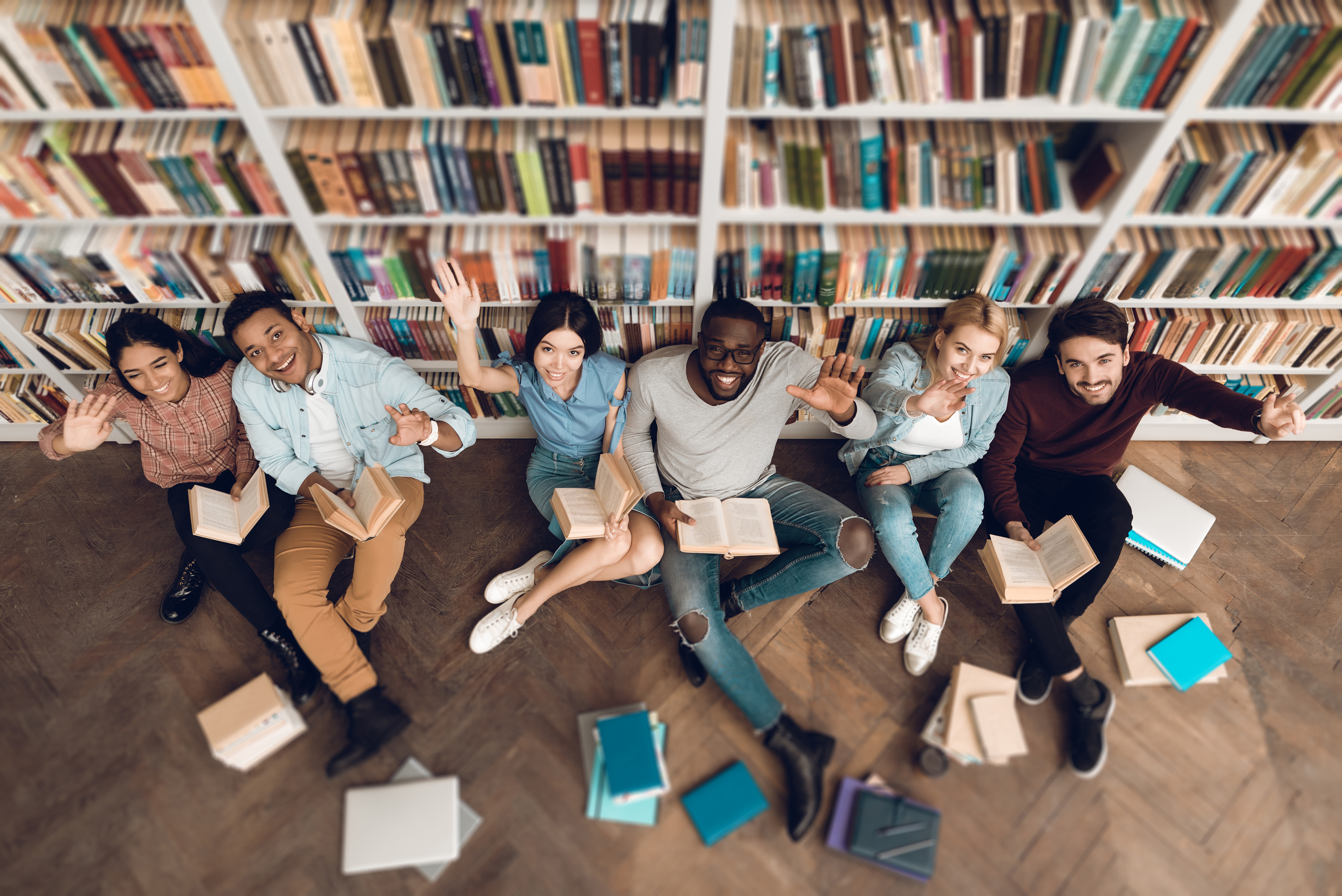 Nakhti University Students sitting on floor in library