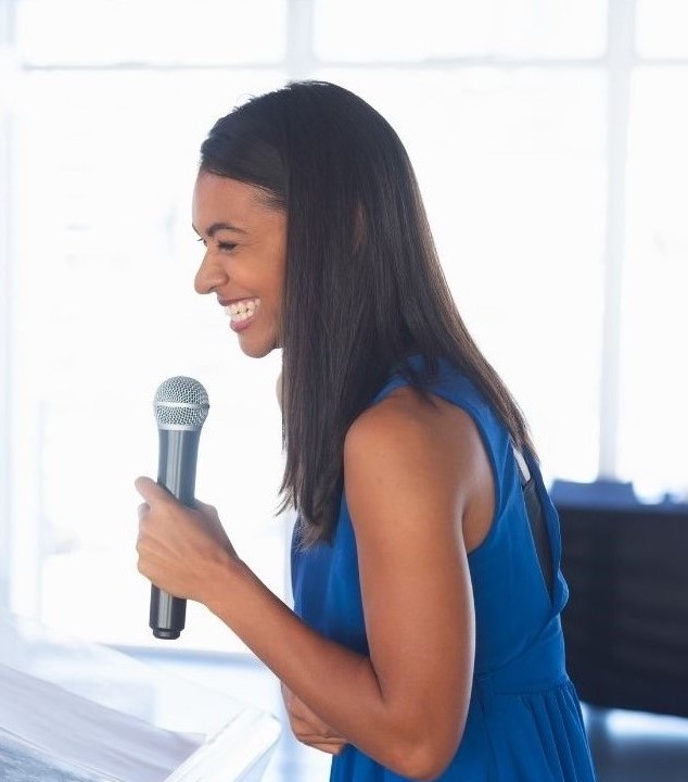 Smiling woman holding microphone