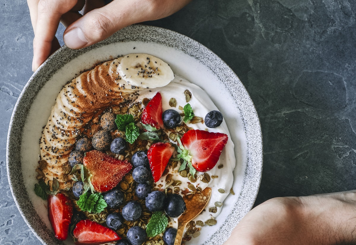 bowl of healthy fruits and yogurt