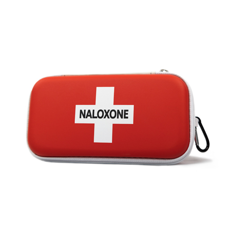 A red and white naloxone kit sits on a shelf