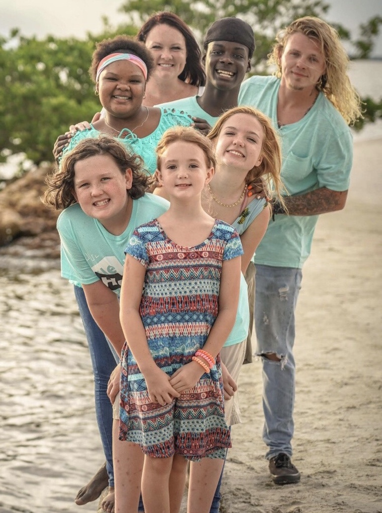 Shasta Mott with kids on beach.