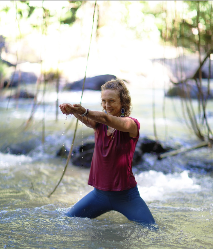 Bex doing her yoga practice in the river