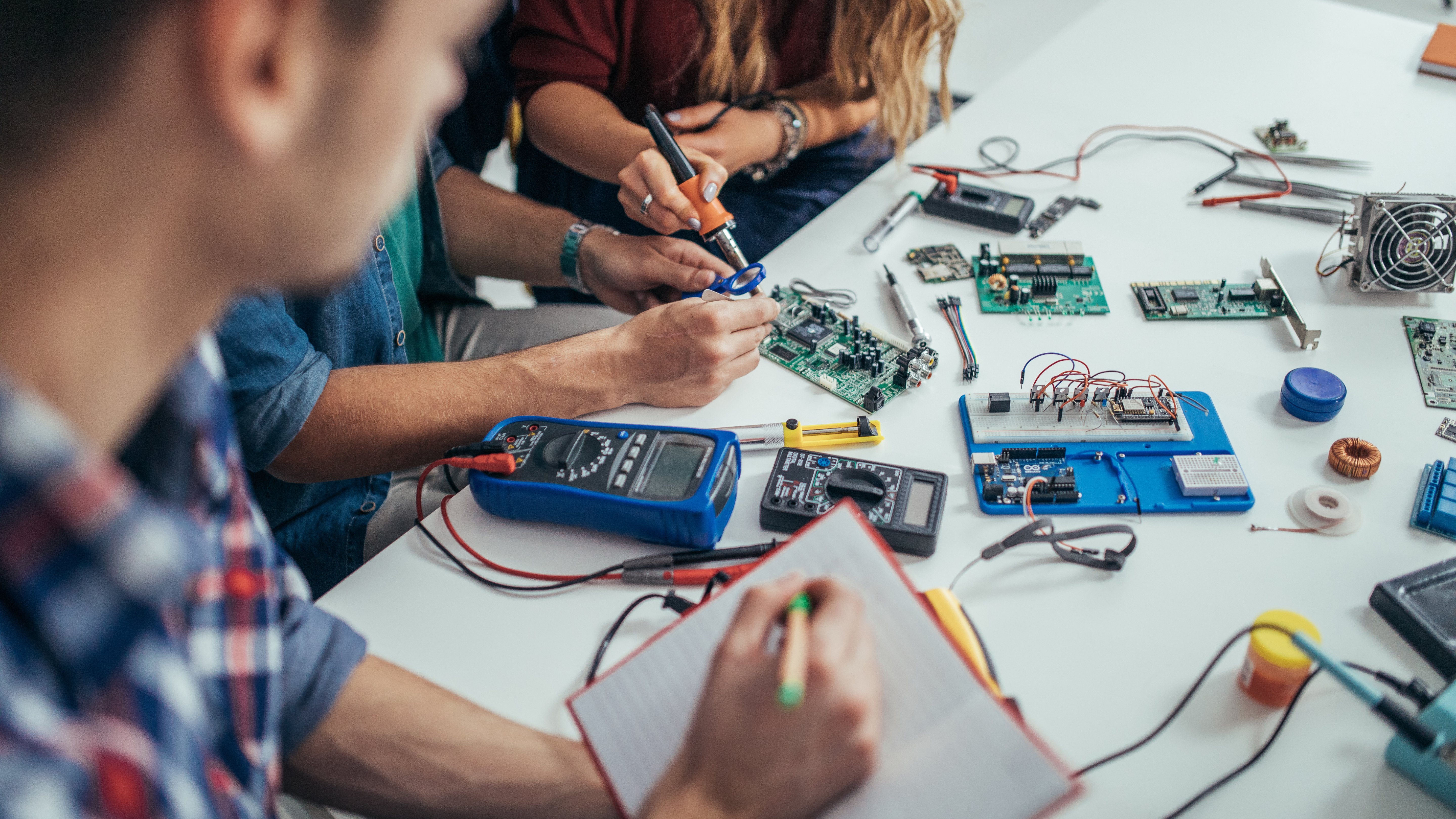 students using soldering tools 