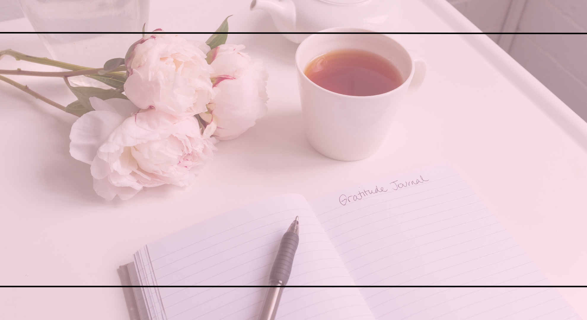 Flowers, tea, and an open journal on a table with a pink overlay