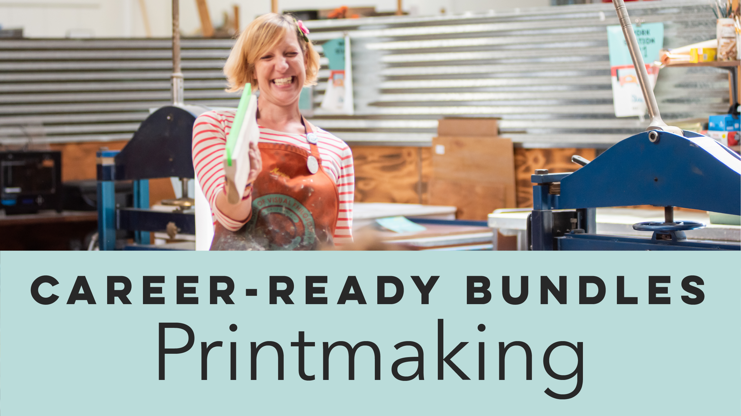 Dana Harris Seeger smiling while holding a printmaking tool.