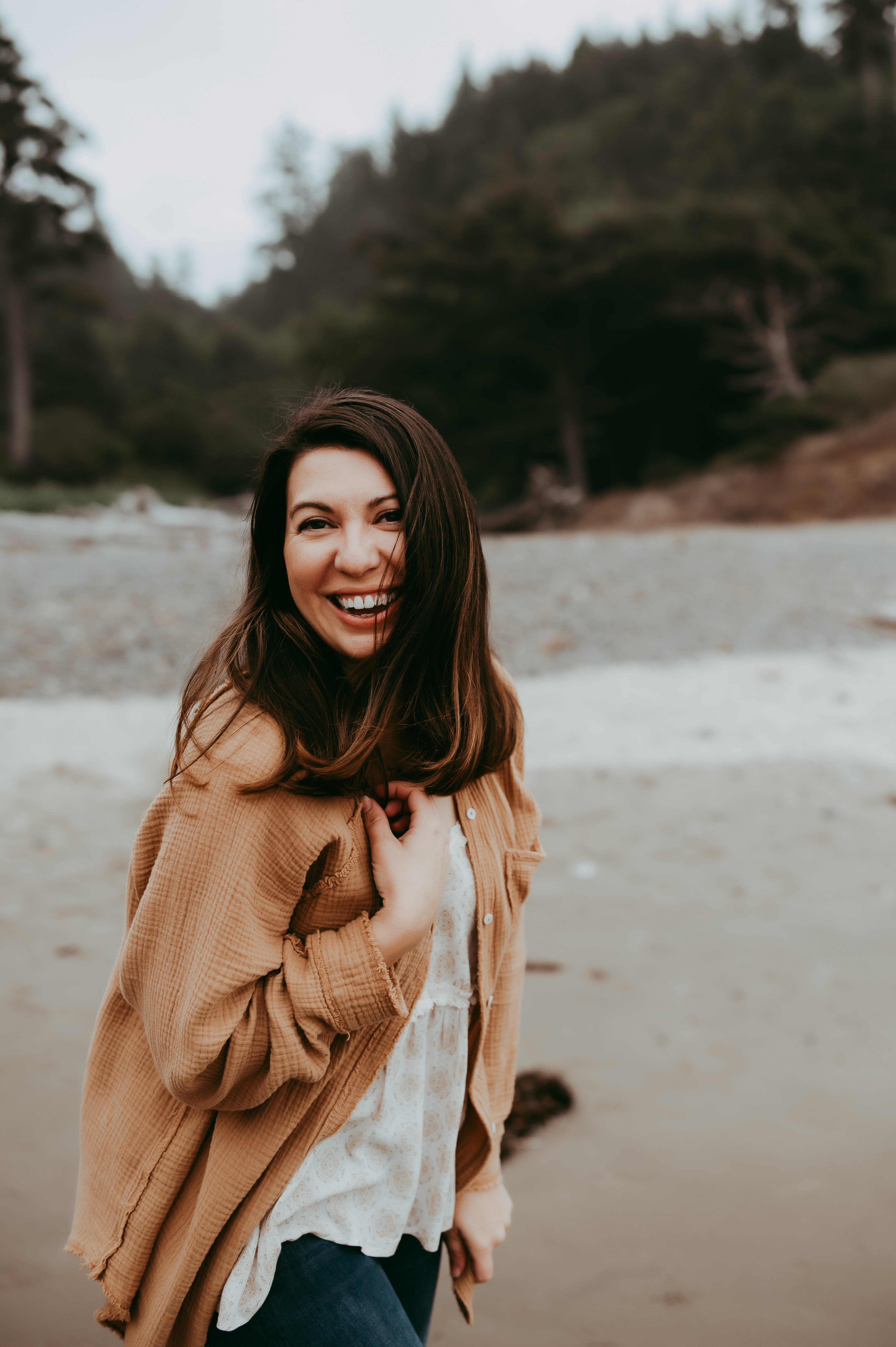 Becca from Becca Jean Photography laughing and looking to the side