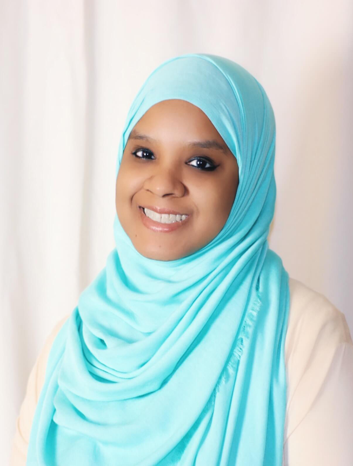 Photo of Umm Zakiyyah in blue hijab