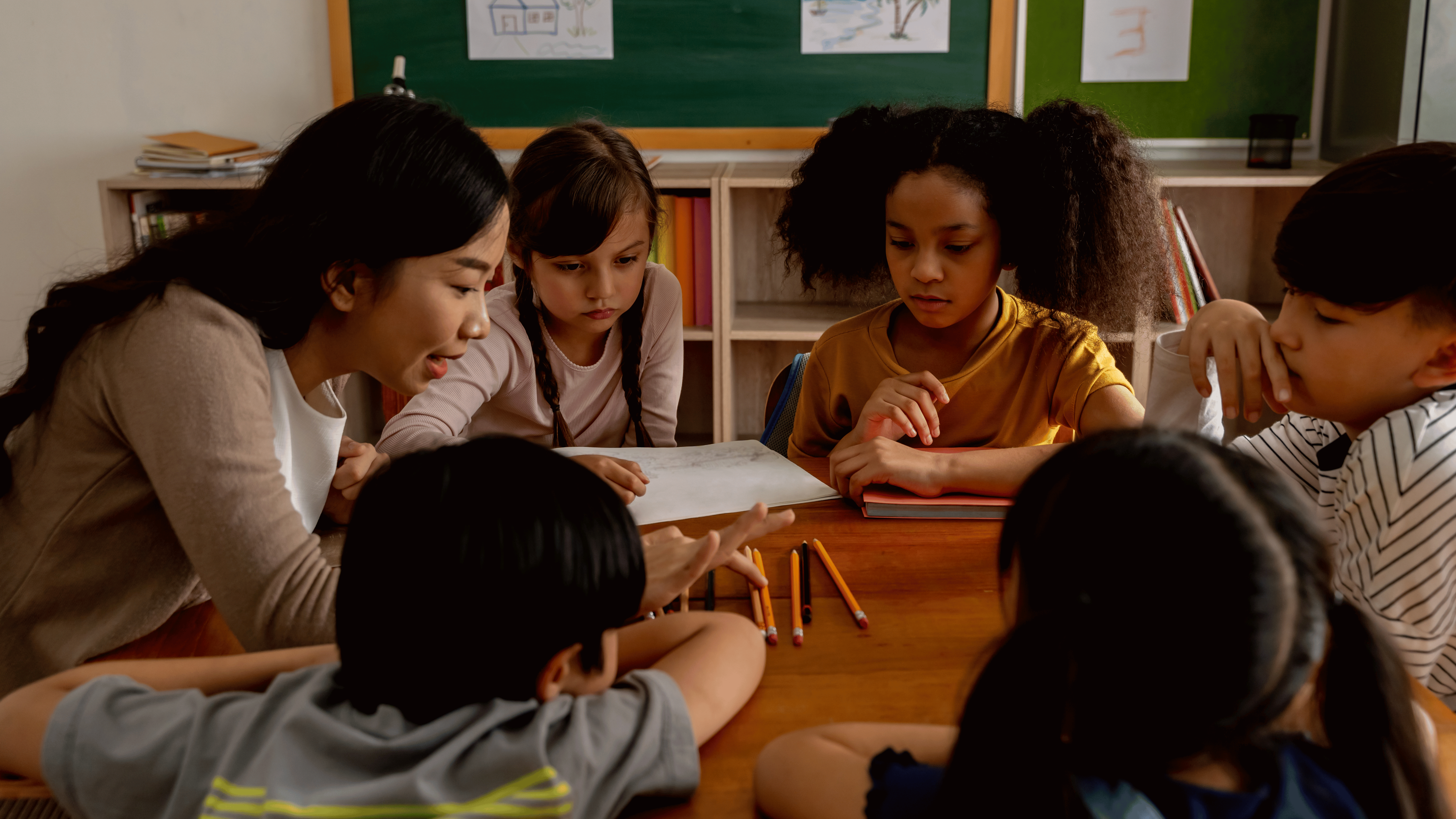 teacher working with small group of students