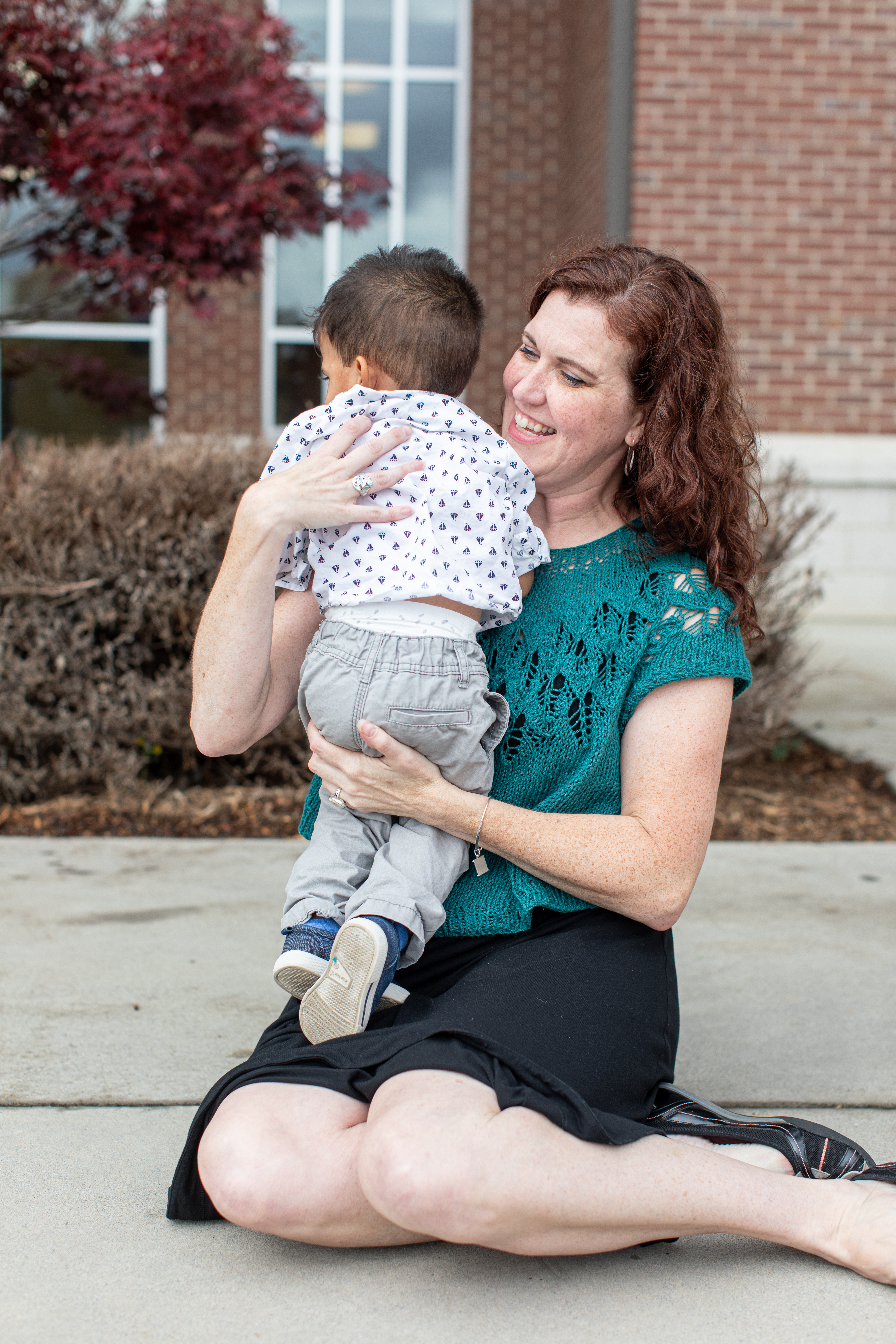 Jennifer holds her son at his adoption