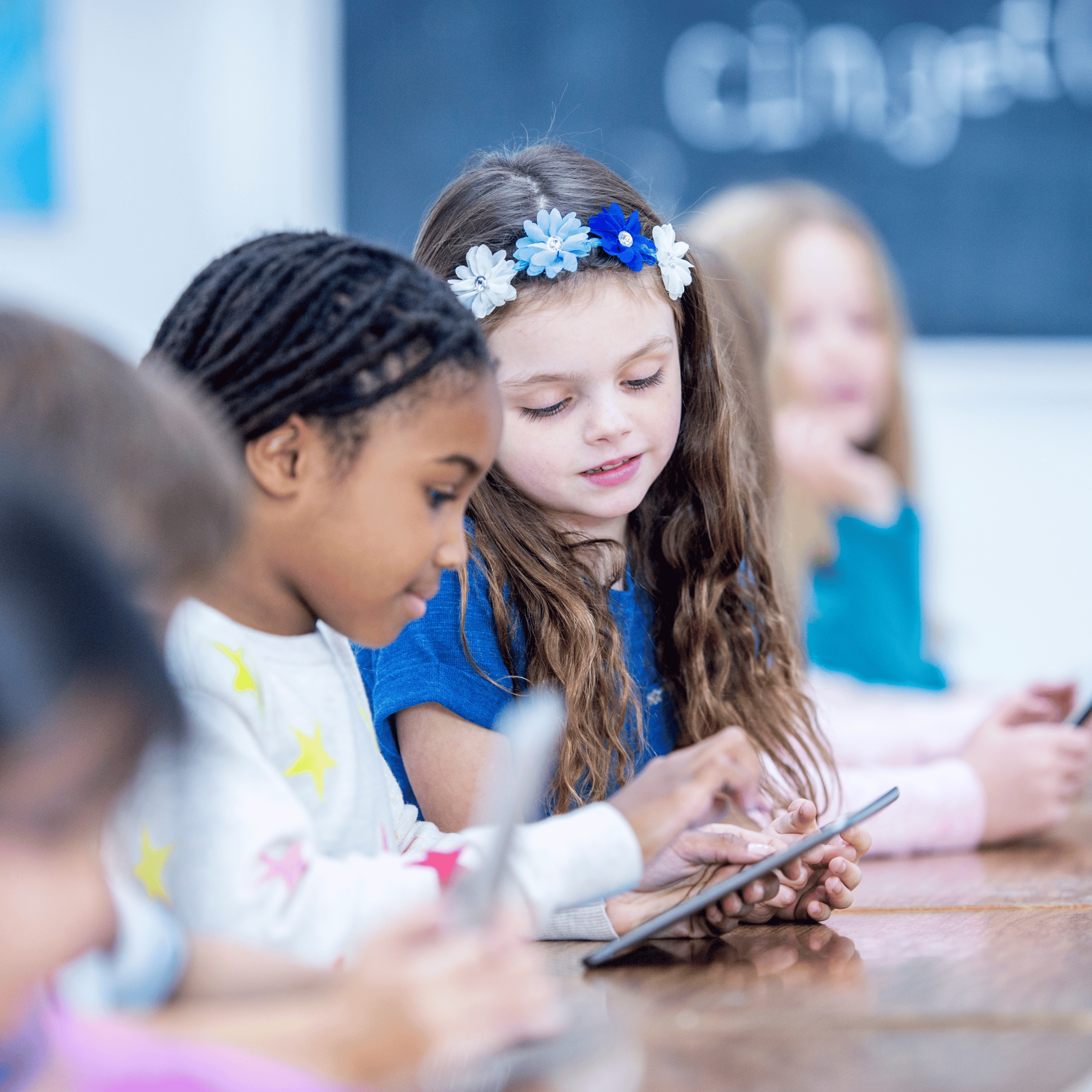 students working together with a mobile device