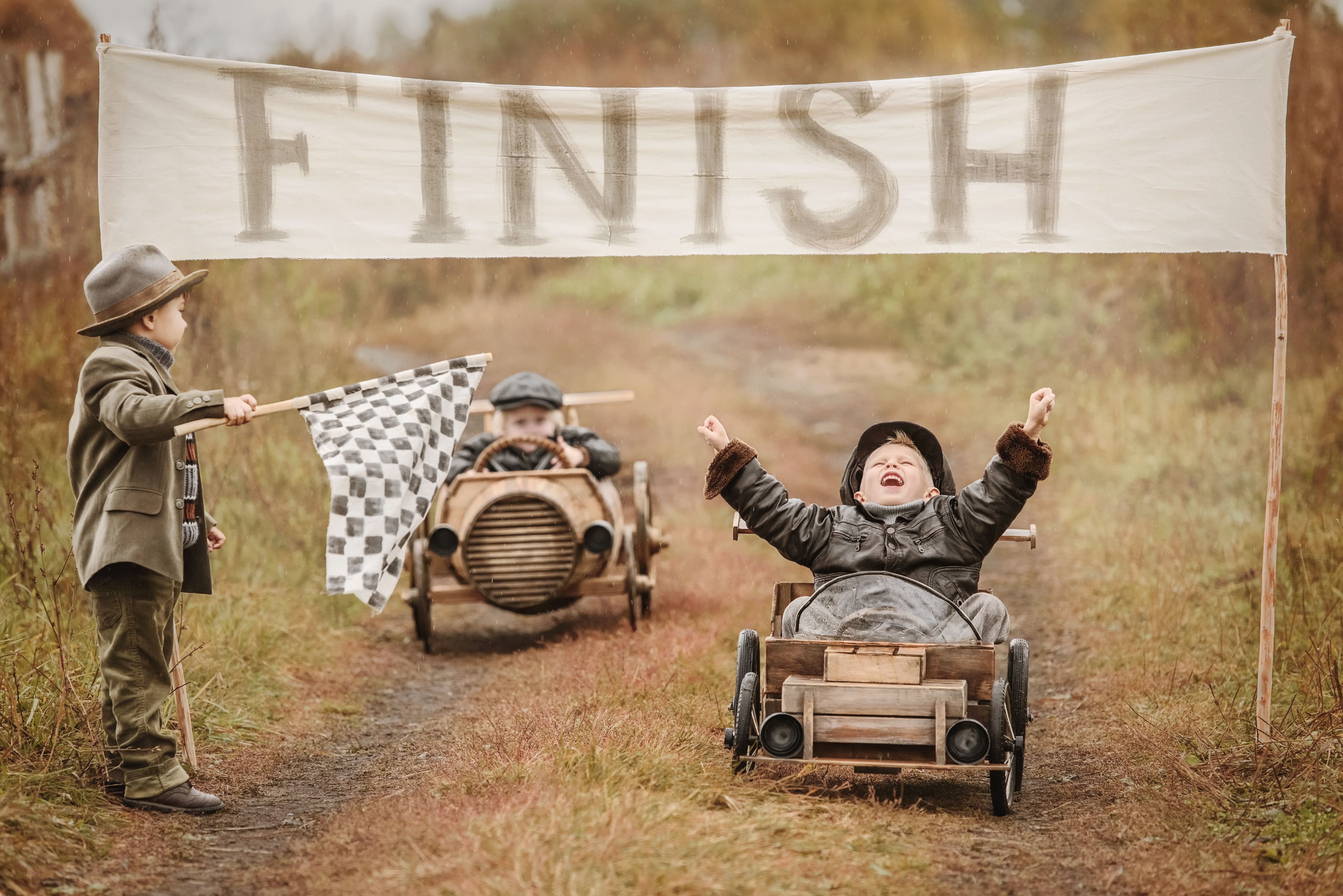 Boys finish a race with self-made cars