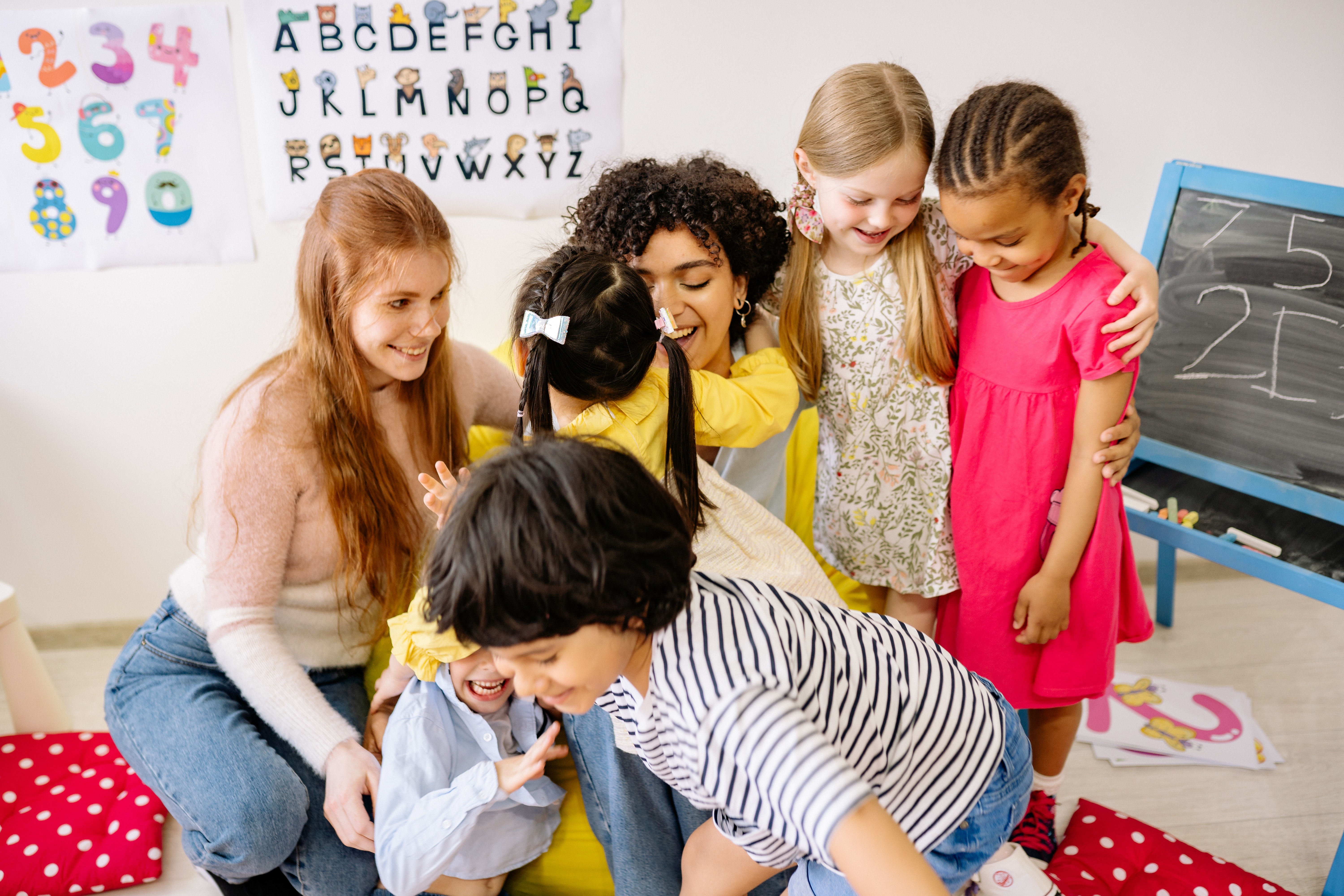 teachers hugging students