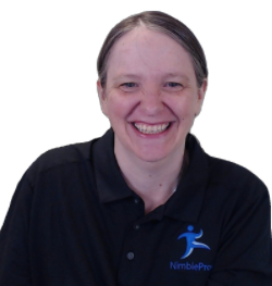 Sadukie, wearing her NimblePros polo and smiling