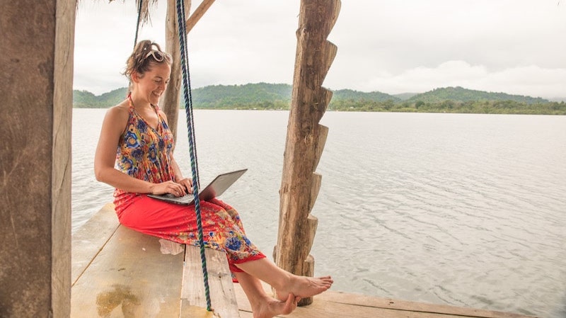 travel blogger working on her laptop