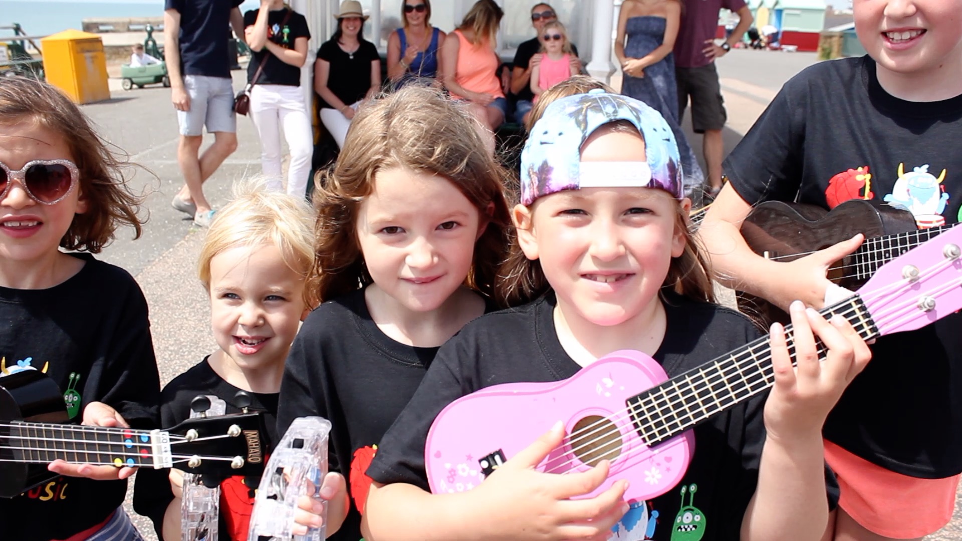 group of children with ukuleles