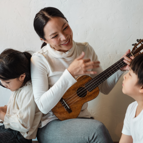 mum and 2 kids play ukulele