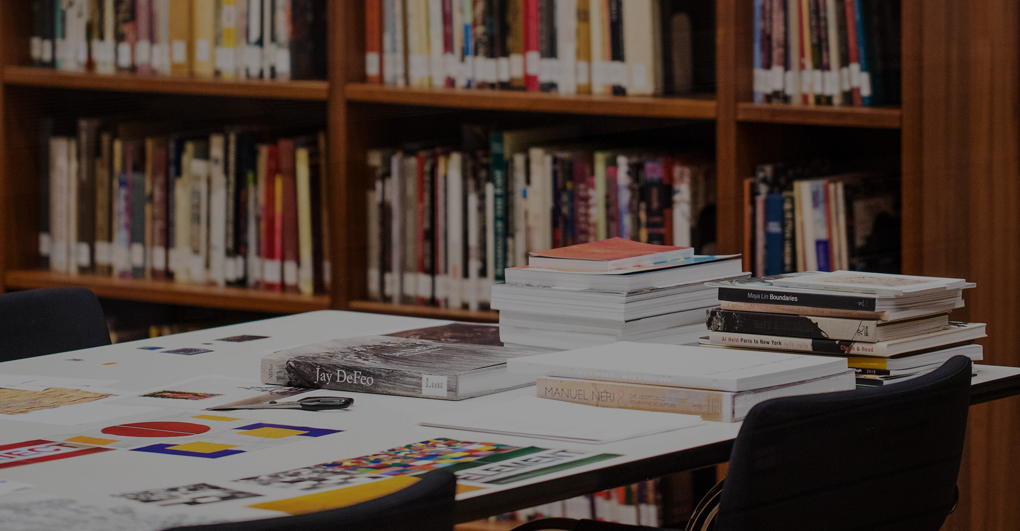 Desk with books in a library