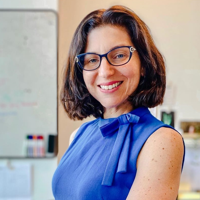 Woman with glasses wearing blue