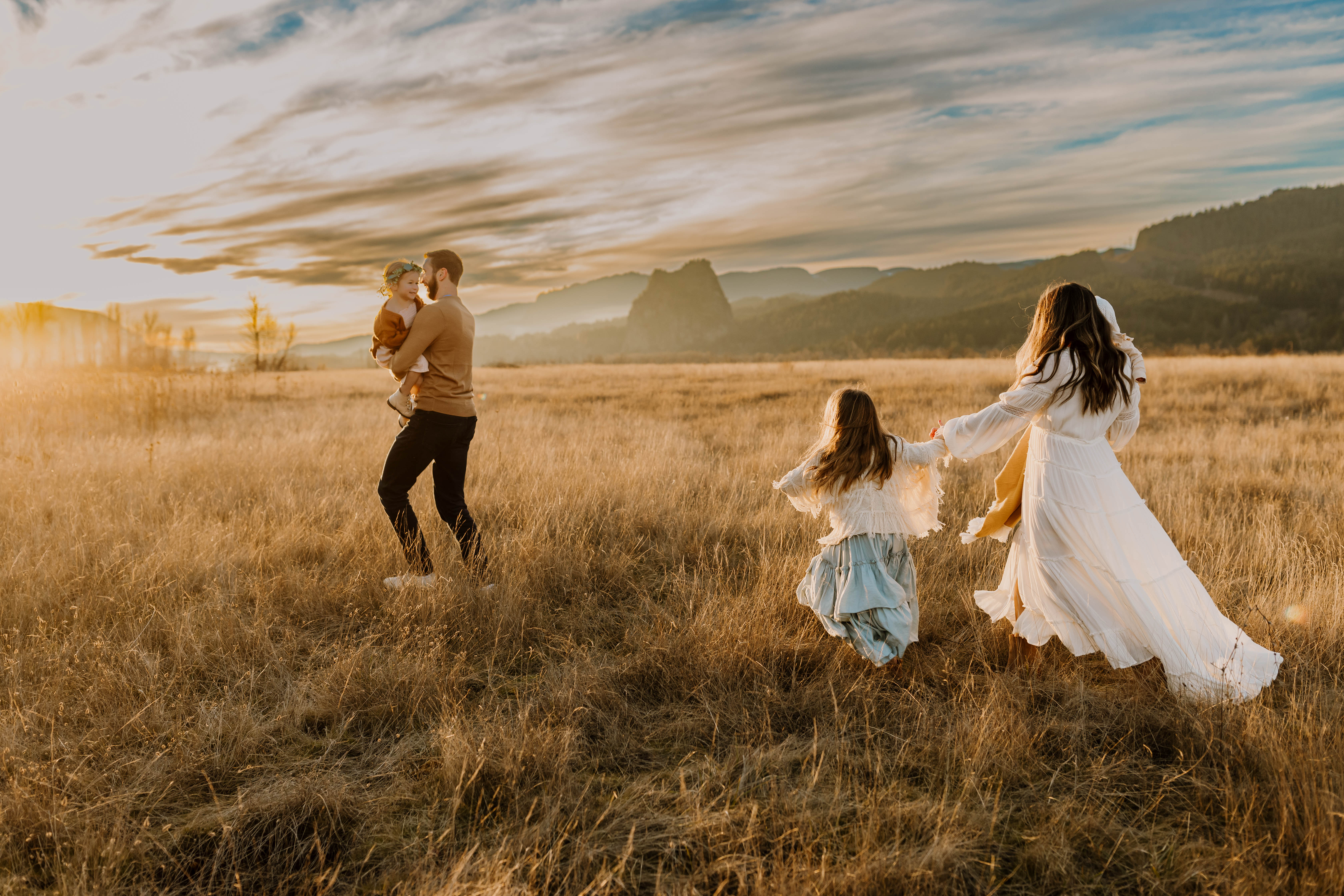 Family playing tag during their family photos