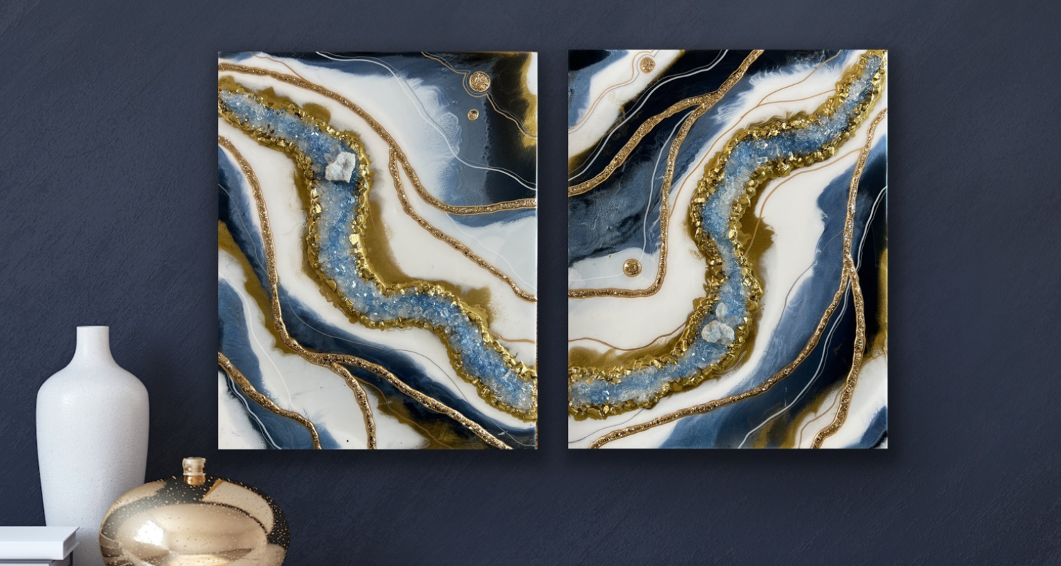 Two-piece wall art set featuring Geode Resin designs with swirling patterns of navy, white, and gold hues, accented with sparkling crystals and metallic details, displayed against a dark grey wall, accompanied by a white vase and a golden decorative orb.