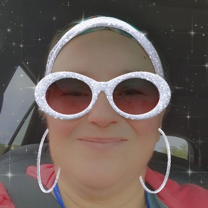 Image: Show your sparkle. Image of face with sparkly glasses, headband and large hoop earrings. 