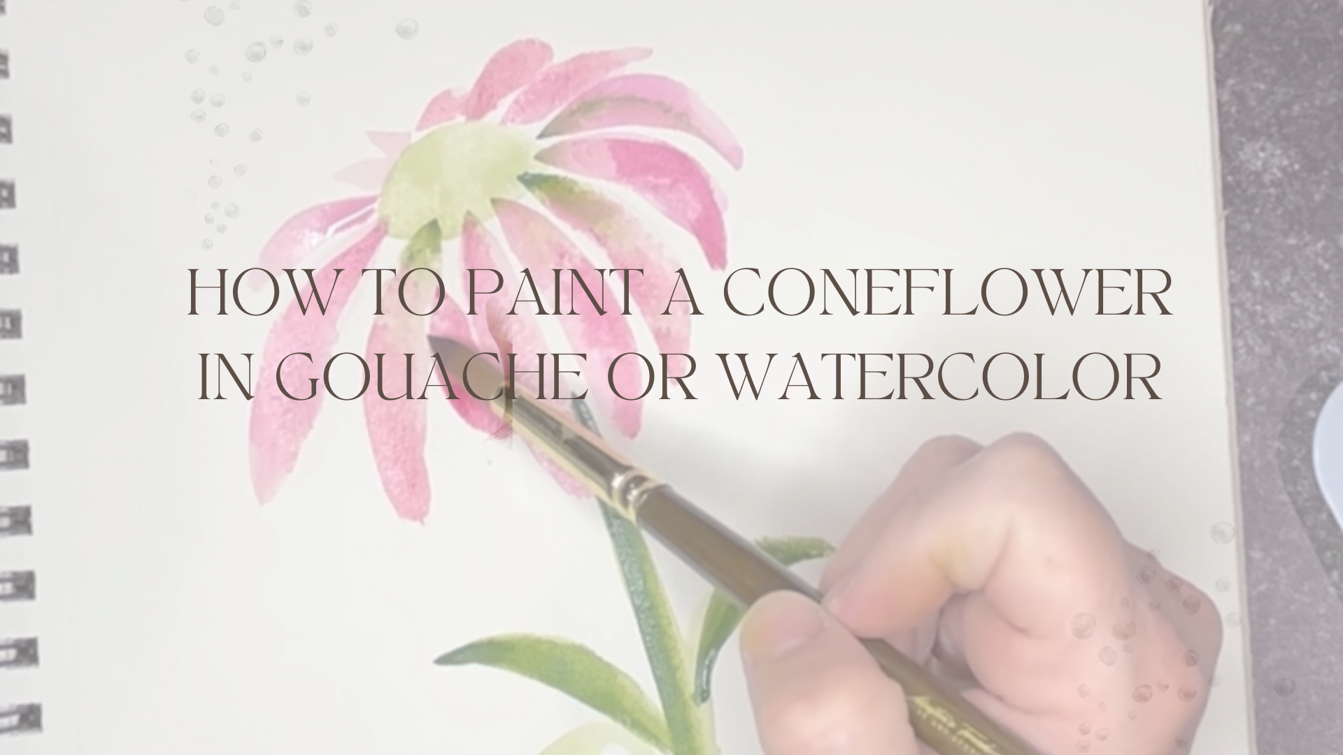 a hand painting a watercolor with a brush