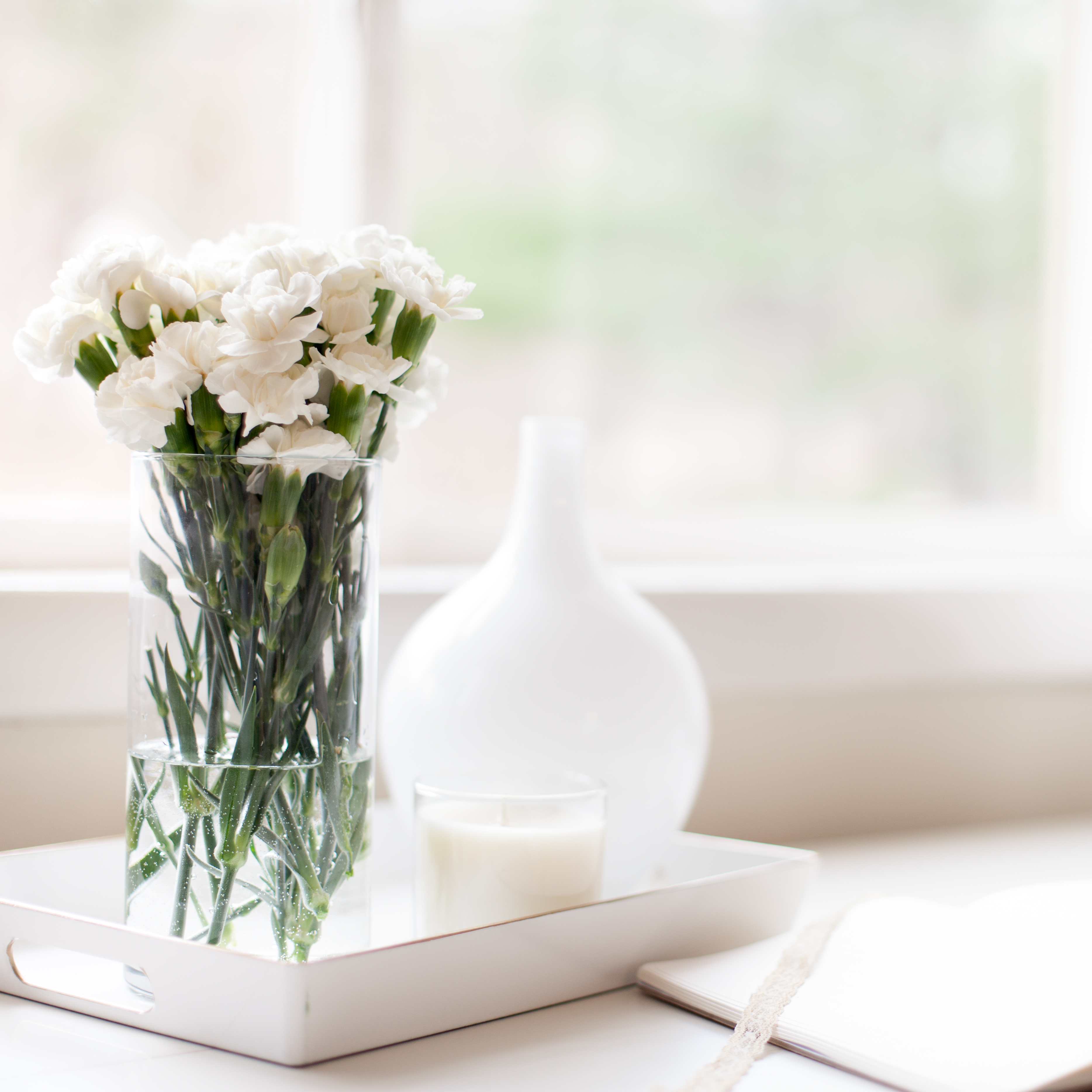 flowers and a journal on a table