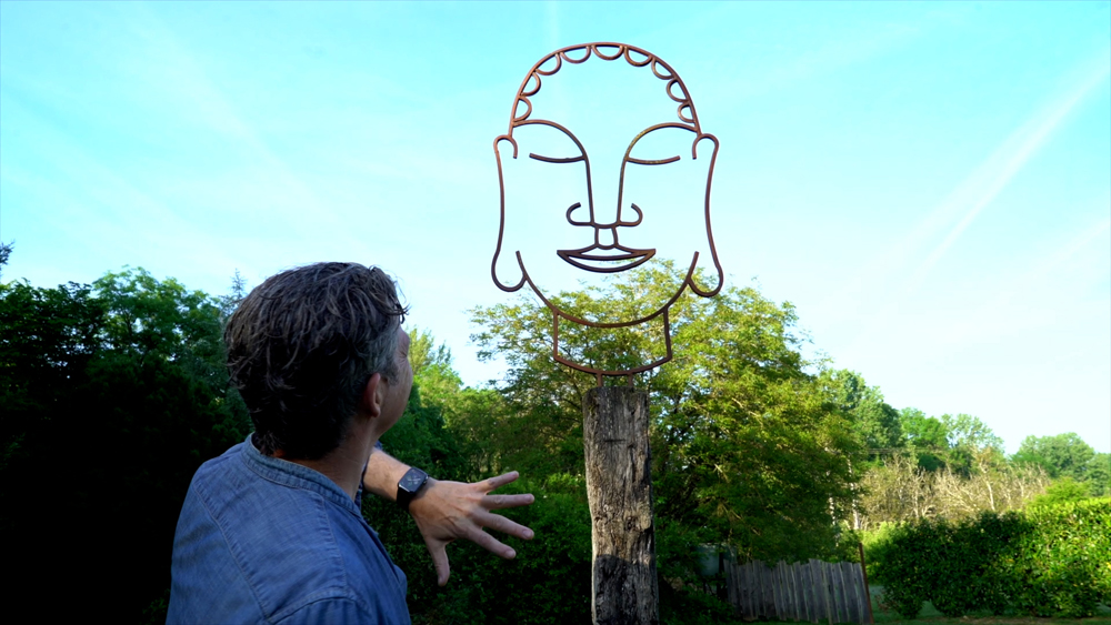 Martin with a Buddha sculpture