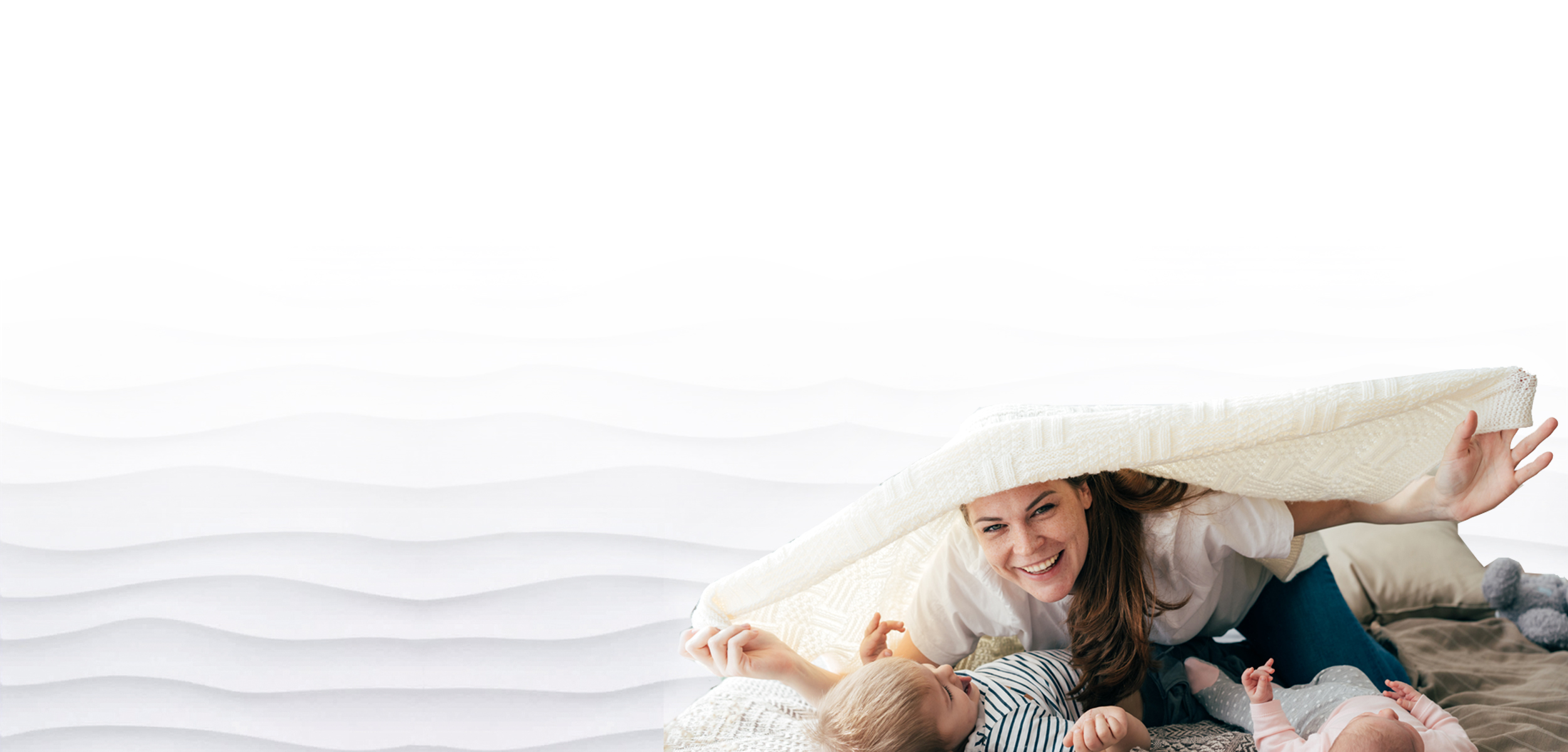 New mom with baby smiling and holding their feet