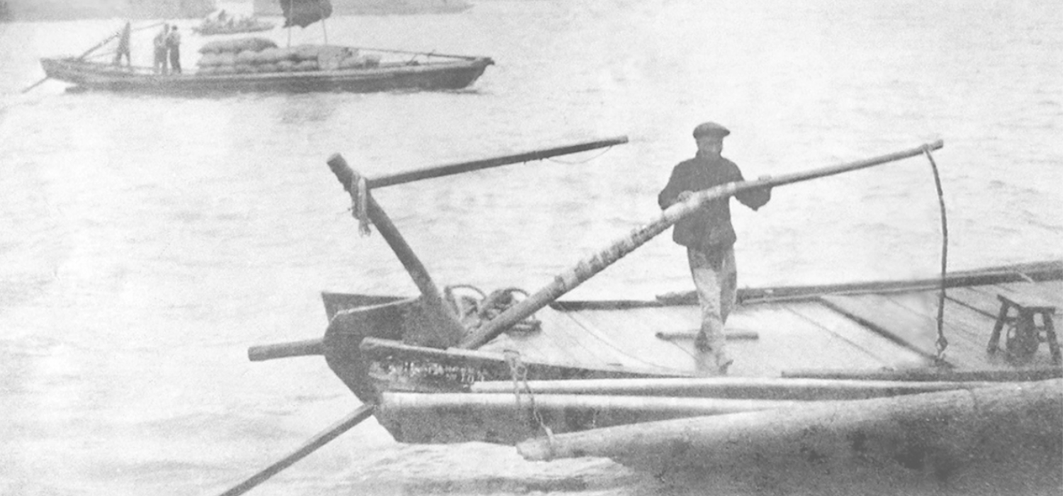 Man Sculling with Single Oar on Yuloh