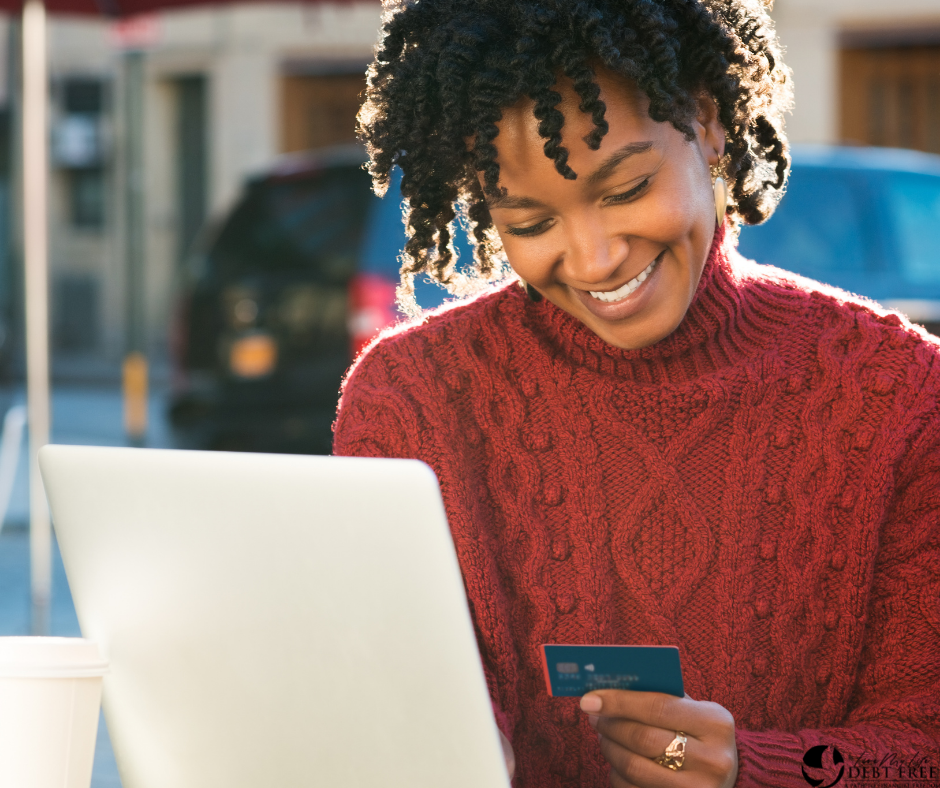 Woman holding credit card