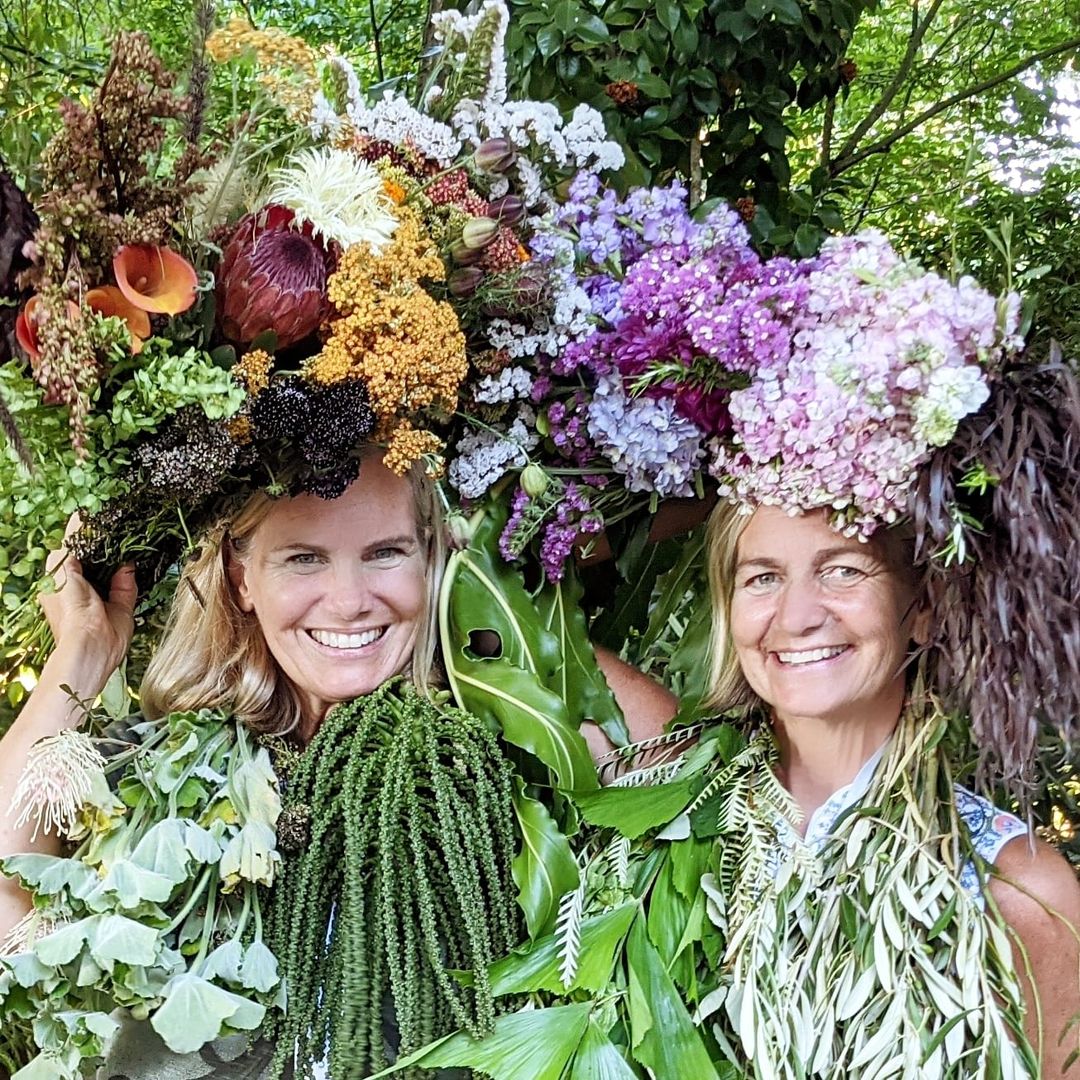 Kit Wertz and Casey Schwartz of Flower Duet with Flowers on their heads